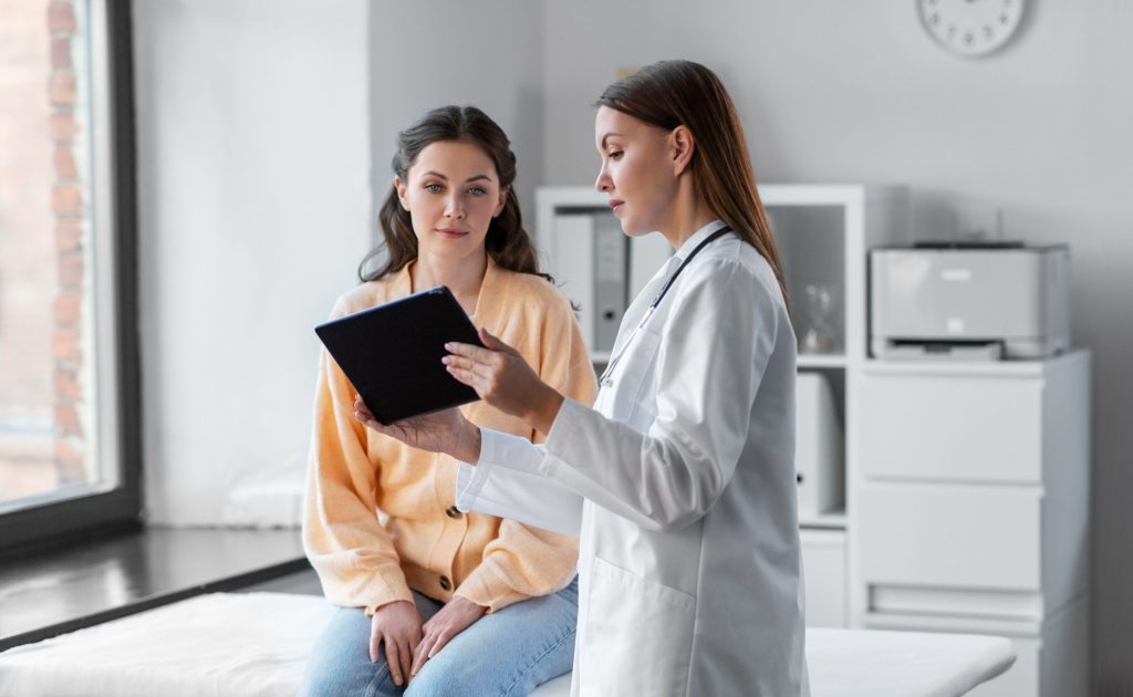 Dentist talking with a patient in the office